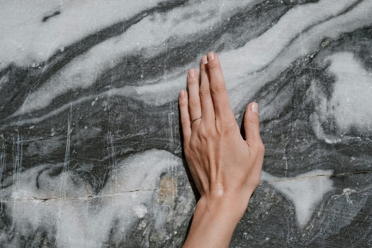 dull etched marble benchtop with acid damage